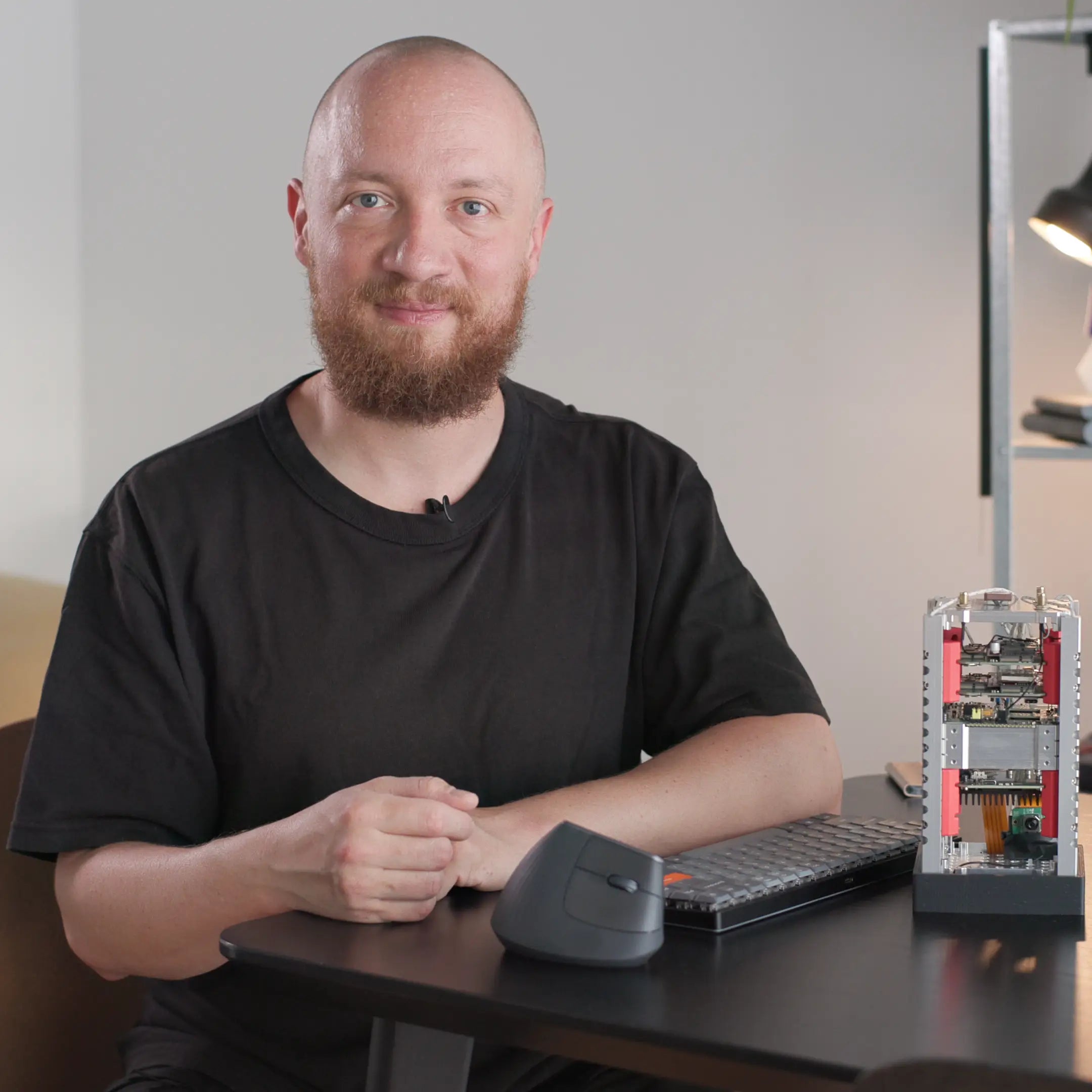 Portrait of Manuel Imboden with a CubeSat prototype