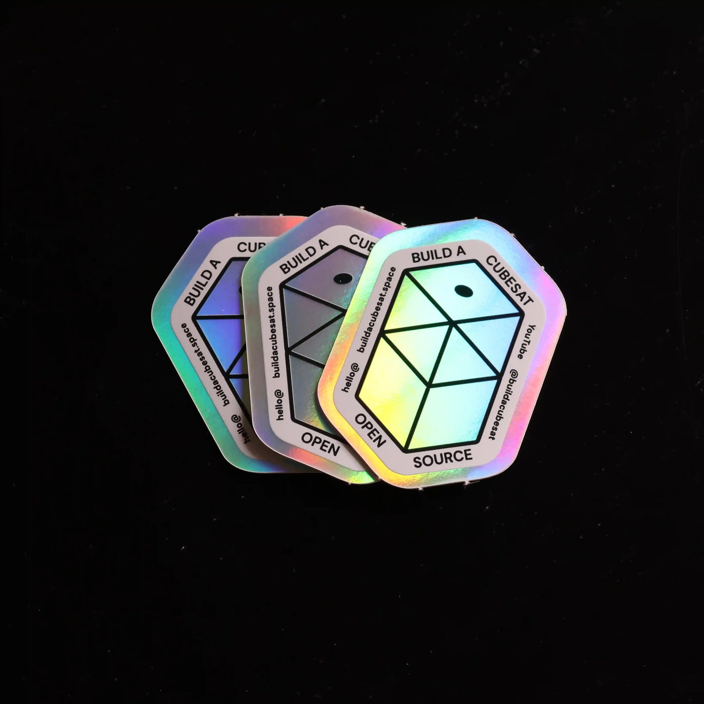 Set of colorful geometric stickers on a black background